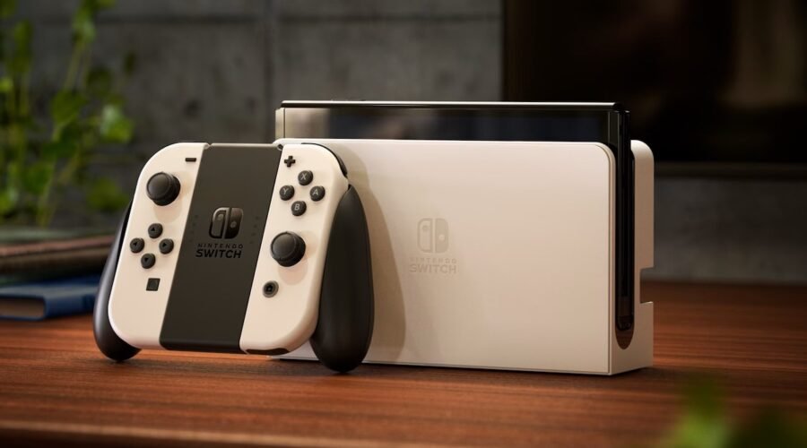 a video game console Nintendo Switch OLED and controller